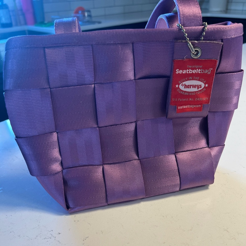 Harvey’s original small purple tote. Never used